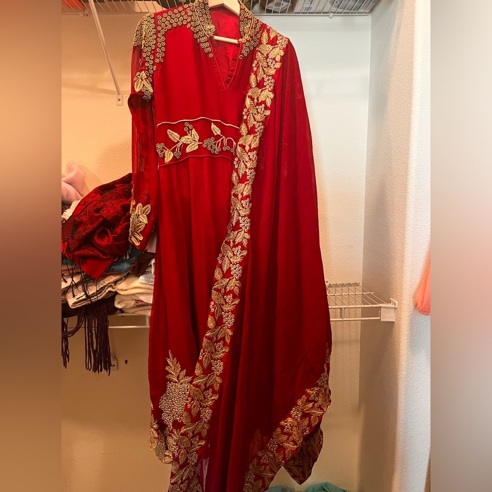 Maroon anarkali suit with beautiful golden embroidery and golden bead work.